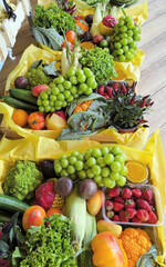 Yellow paper cradles vibrant harvest bounty, organic abundance for Vegan Solstice Feast or Mediterranean Gastronomy Day celebrations