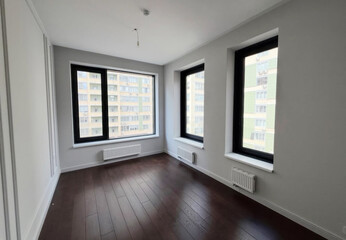 Sunlight floods a minimalist urban flat, embracing new beginnings, feng shui principles, and contemplative International Space Day musings