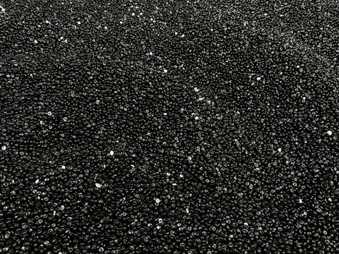 Black granulated plastic polymer. Virgin polypropylene pellets or virgin PP granules. Polypropylene homopolymer pellets. Base polymer