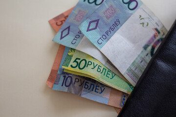 Belarusian ruble banknotes sticking out of wallet