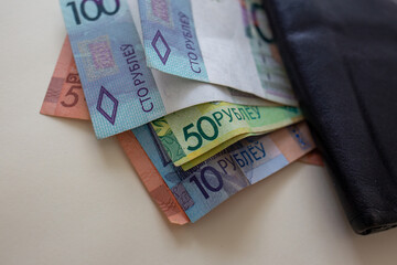 Belarusian ruble banknotes sticking out of wallet