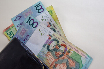 Belarusian ruble banknotes sticking out of wallet