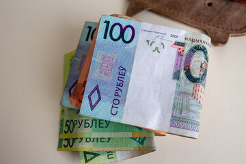 Stack of Belarusian ruble banknotes with wallet