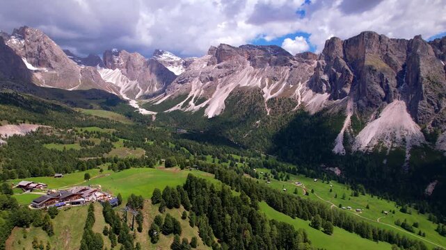 Stunning vew of beautiful Alps mountains Dolomites, Col Raiser viewpoint and cable way to Seceda, from Santa Cristina villaget south Tyrol Italy. Alpine nature scenery. aerial drone footage 4kHD
