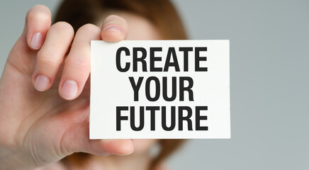 Create Your Future text on card in hand business Women