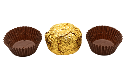 Golden wrapped chocolate truffle with two empty brown paper candy wrappers isolated on transparent background