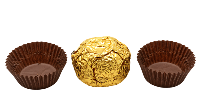 Golden wrapped chocolate truffle with two empty brown paper candy wrappers isolated on transparent background