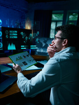 Professional analyst reviewing digital data dashboards with futuristic projections. Concept of data analytics, decision making, fintech strategies, and digital transformation. Collage