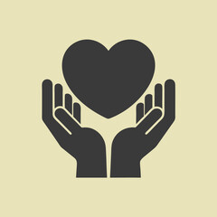 Obraz premium Silhouette of hands gently cupping a heart symbol representing love care charity hope