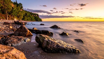 Peaceful sunset over a rocky shoreline
