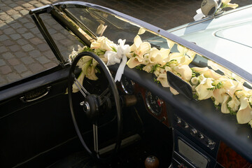 Classic convertible decorated with yellow flowers for a wedding or special occasion. Brussels, Belgium