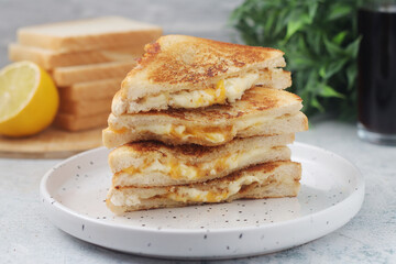 Grilled cheese sandwiches served for eating