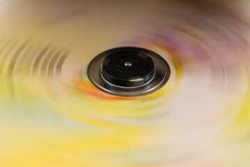 Abstract spinning disc with yellow and pink motion blur background