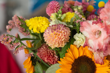 Vibrant mixed flower bouquet featuring sunflowers, dahlias, and carnations