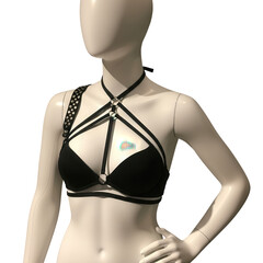 Black strappy harness bra on mannequin isolated on transparent background