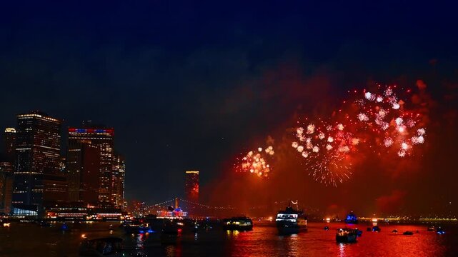Amazing fireworks flashing in the dark sky over the East River. 4th July celebration in New York, USA. View from the waterscape.