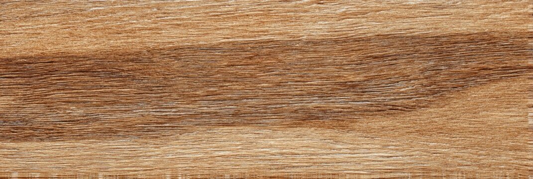 Close-up of a wood grain texture showing light and dark brown tones in a horizontal pattern with subtle variations in color and density