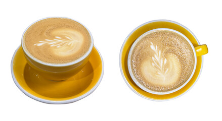Two yellow ceramic cups with cappuccino and latte art on milk foam, isolated on transparent background. Coffee top view and angled shot, modern cafe drink design.