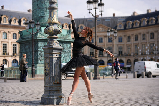 Graceful ballerina performing outdoors in city center - Powered by Adobe