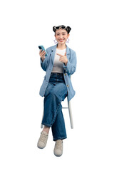 Asian Woman holding and pointing at a smartphone. The woman is seated, with a casual smile, with a playful hairstyle and earrings.on PNG