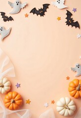 Pastel beige background and colorful Halloween decor in the form of ghosts and pumpkins