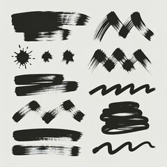 Collection of black brush strokes and splatters on a white background creates an abstract design