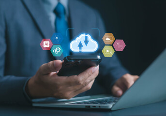 Businessman using smartphone with cloud computing and AI icons, symbolizing digital transformation, data storage, machine learning, technology innovation, online services, and smart business solutions