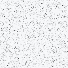 Abstract terrazzo seamless pattern with scattered stone chips in gray and black tones on white background texture.