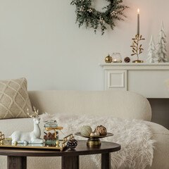 Christmas compositions on the wooden coffee table with tray and decorations. Close up. Christmas is coming. Home decor.	