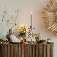 Wooden cabinet with Christmas decor, nutcracker, and wrapped gifts. Elegant and festive interior setup for the holiday season.	