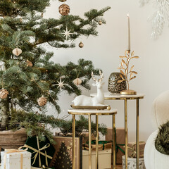 Christmas living room featuring a decorated tree, cozy textiles, and elegant golden accents. A serene and inviting holiday ambiance perfect for seasonal inspiration.