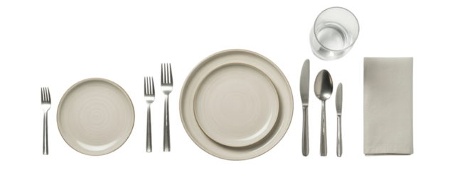 Elegant neutral place setting for dining featuring plates, silverware, a napkin and glass of water creating a modern and sophisticated table arrangement ready for a delicious meal