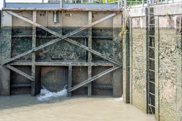 low level water inside lock on Brenta canal, Mira, Italy