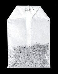 White tea bag with loose tea inside