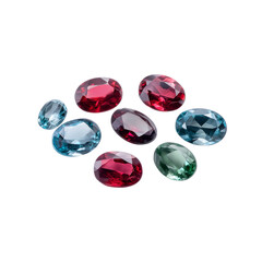 Fototapeta premium Colorful and Shiny Gemstones in Various Shapes and Sizes on White Background for Jewelry Design and Decoration