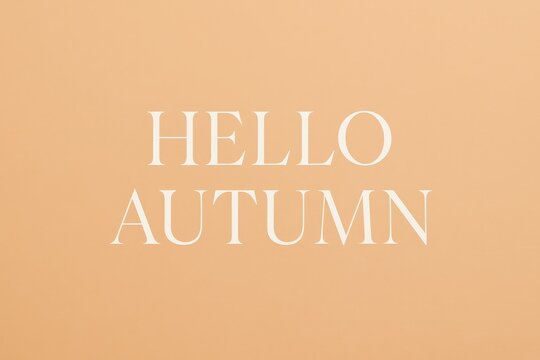 Hello autumn text on peach pastel background