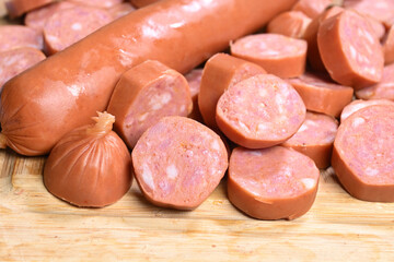 closeup of cut raw pepperoni sausages