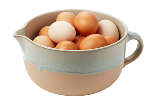 Isolated still life of farm fresh chicken eggs in a ceramic mixing bowl ready for baking