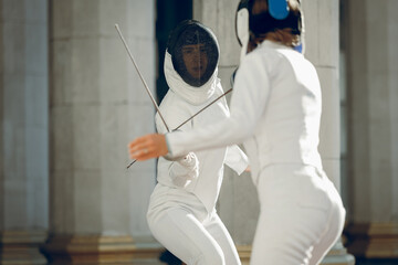 Fencing in the castle. Fencer womens.