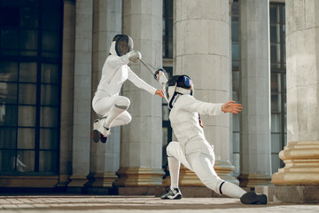 Fencing in the castle. Fencer womens.