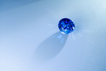 Blue gemstone on white background. Sparkling precious stone symbolizing luxury, wealth, elegance, beauty, and jewelry design. Perfect for fashion, accessories, and investment concepts.