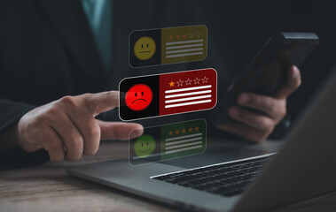 Person giving one-star review on smartphone and laptop, representing negative feedback, poor service, dissatisfaction, customer complaint, online rating, and bad experience in digital business.