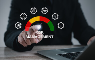 Executive pointing at risk management gauge on virtual interface, symbolizing strategy, business analysis, corporate planning, financial control, project safety, and effective decision-making.