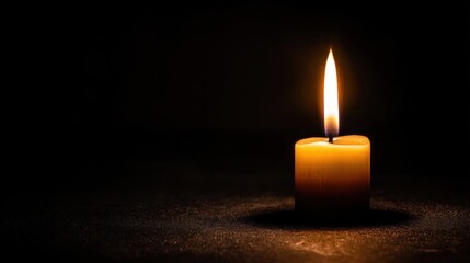 Glowing Candle in Darkness: A single candle emits a warm, inviting glow against a stark, black backdrop, evoking feelings of serenity, reflection, and the comforting embrace of light in the unknown.