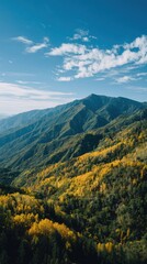 Majestic Mountain Vista: Capturing the sweeping panorama of towering mountain ranges under a bright blue sky adorned with delicate clouds, an awe-inspiring view of nature's grandeur.