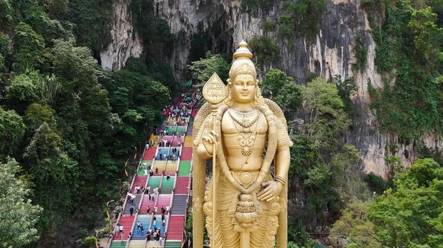 Aerial view of batu caves with lord murugan statue and colorful stairs