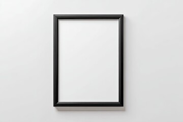 Empty black picture frame on white wall (1)