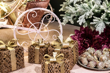 vintage romantic Christmas interior with gifts and Christmas tree in gold and pink colors, selective focus