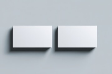 Two blank business cards on a light gray background