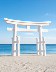White torii gate on sandy beach